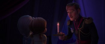 Movie still from “Frozen II” (2019), directed by Jennifer Lee – A man lighting a candle next to a little girl; Medium shot, Over the shoulder angle