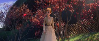 Movie still from “Frozen II” (2019), directed by Jennifer Lee – A woman standing in front of some trees; Wide shot, Low angle