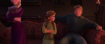 Movie still from “Frozen II” (2019), directed by Jennifer Lee – A young girl with her arms crossed is looking at an older man; Medium shot, Over the shoulder angle