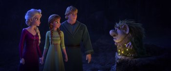 Movie still from “Frozen II” (2019), directed by Jennifer Lee – A couple of people standing next to each other in front of an animal; Medium shot, Over the shoulder angle