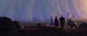 Movie still from “Frozen II” (2019), directed by Jennifer Lee – A group of people standing on top of a sandy beach; Extreme Wide shot, Low angle