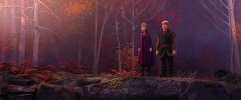 Movie still from “Frozen II” (2019), directed by Jennifer Lee – A couple of people standing on top of a rock; Wide shot, High angle