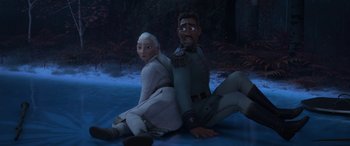 Movie still from “Frozen II” (2019), directed by Jennifer Lee – A man and a woman sitting next to each other on the ground; Medium shot, High angle