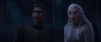 Movie still from “Frozen II” (2019), directed by Jennifer Lee – A man and a woman standing next to each other in front of a forest; Close Up shot, Over the shoulder angle