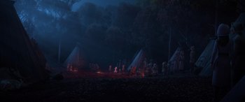 Movie still from “Frozen II” (2019), directed by Jennifer Lee – A group of people sitting around a campfire at night; Extreme Wide shot, High angle