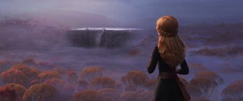 Movie still from “Frozen II” (2019), directed by Jennifer Lee – A woman standing in front of a large waterfall; Extreme Wide shot, Over the shoulder angle