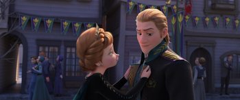 Movie still from “Frozen II” (2019), directed by Jennifer Lee – A woman putting a collar on a man's chest; Close Up shot, Over the shoulder angle