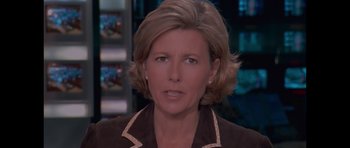 Movie still from “Fugitive: The Curious Case of Carlos Ghosn” (2022), directed by Lucy Blakstad – A person wearing a brown jacket; Close Up shot, High angle