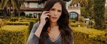 Movie still from “Furious 7” (2015), directed by James Wan – A woman talking on a cell phone while standing in front of a house; Close Up shot, High angle