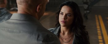 Movie still from “Furious 7” (2015), directed by James Wan – A man and a woman looking at one another; Close Up shot, Over the shoulder angle