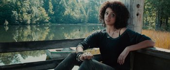 Movie still from “Furious 7” (2015), directed by James Wan – A woman sitting in a boat on a river; Close Up shot, Over the shoulder angle