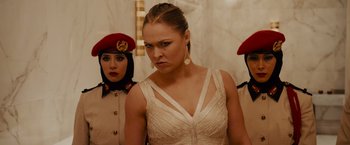 Movie still from “Furious 7” (2015), directed by James Wan – A woman in a white dress and two other women in military uniforms; Close Up shot, Over the shoulder angle