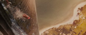 Movie still from “Furious 7” (2015), directed by James Wan – A view of a skyscraper from a helicopter; Extreme Wide shot, Overhead angle