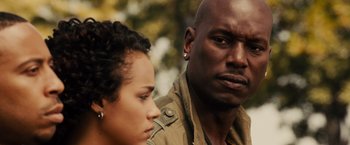 Movie still from “Furious 7” (2015), directed by James Wan – A man and a woman looking at one another; Close Up shot, Over the shoulder angle