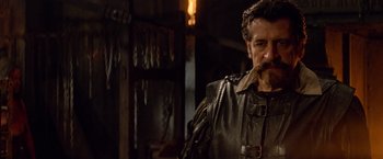 Movie still from “G.I. Joe: The Rise of Cobra” (2009), directed by Stephen Sommers – A person wearing a leather jacket; Medium shot, Over the shoulder angle