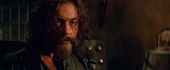 Movie still from “G.I. Joe: The Rise of Cobra” (2009), directed by Stephen Sommers – A person with a beard; Close Up shot, Over the shoulder angle
