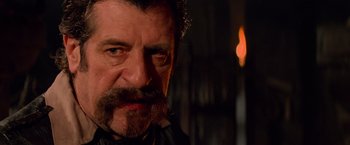 Movie still from “G.I. Joe: The Rise of Cobra” (2009), directed by Stephen Sommers – A person with a beard; Close Up shot, Over the shoulder angle