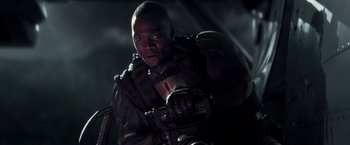 Movie still from “G.I. Joe: The Rise of Cobra” (2009), directed by Stephen Sommers – A man with a gun in his hand; Close Up shot, Low angle