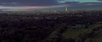 Movie still from “G.I. Joe: The Rise of Cobra” (2009), directed by Stephen Sommers – A view of the eiffel tower from a distance at night; Extreme Wide shot, High angle