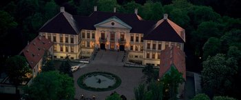 Movie still from “G.I. Joe: The Rise of Cobra” (2009), directed by Stephen Sommers – An aerial view of a large mansion at night; Extreme Wide shot, High angle