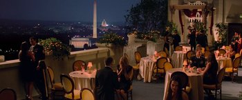 Movie still from “G.I. Joe: The Rise of Cobra” (2009), directed by Stephen Sommers – Two people are sitting at a table with a view of the washington monument in the background; Extreme Wide shot, High angle