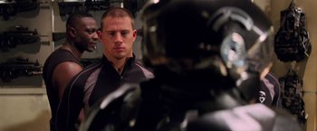 Movie still from “G.I. Joe: The Rise of Cobra” (2009), directed by Stephen Sommers – A man standing next to another man in front of a mirror; Close Up shot, Over the shoulder angle