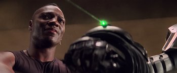 Movie still from “G.I. Joe: The Rise of Cobra” (2009), directed by Stephen Sommers – A person holding a helmet; Close Up shot, Low angle