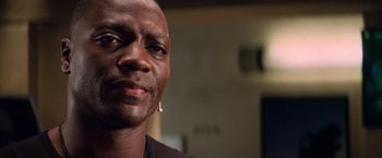 Movie still from “G.I. Joe: The Rise of Cobra” (2009), directed by Stephen Sommers – A person wearing a black shirt; Close Up shot, Low angle