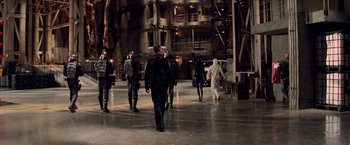 Movie still from “G.I. Joe: The Rise of Cobra” (2009), directed by Stephen Sommers – A group of people walking in a building; Wide shot, Low angle