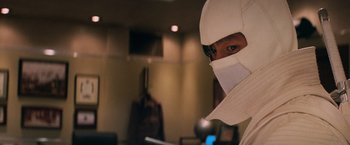 Movie still from “G.I. Joe: The Rise of Cobra” (2009), directed by Stephen Sommers – A man wearing a white mask and a white helmet; Close Up shot, Low angle