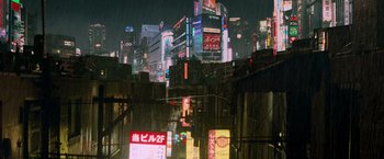 Movie still from “G.I. Joe: The Rise of Cobra” (2009), directed by Stephen Sommers – A view of a city at night from the street; Extreme Wide shot, High angle