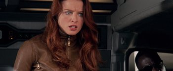 Movie still from “G.I. Joe: The Rise of Cobra” (2009), directed by Stephen Sommers – A person with long red hair; Close Up shot, Over the shoulder angle