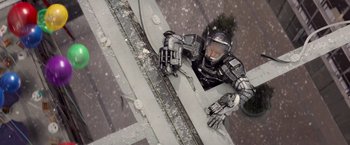 Movie still from “G.I. Joe: The Rise of Cobra” (2009), directed by Stephen Sommers – A man in a space suit is climbing up the side of a building; Wide shot, Overhead angle