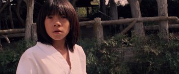 Movie still from “G.I. Joe: The Rise of Cobra” (2009), directed by Stephen Sommers – A young woman with brown hair wearing a white shirt; Close Up shot, Low angle