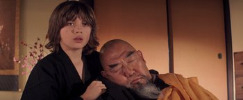 Movie still from “G.I. Joe: The Rise of Cobra” (2009), directed by Stephen Sommers – A man and a woman sitting next to each other; Close Up shot, Over the shoulder angle