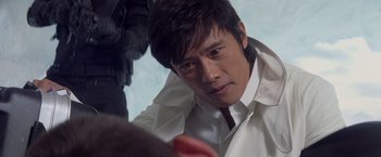 Movie still from “G.I. Joe: The Rise of Cobra” (2009), directed by Stephen Sommers – A person wearing a suit and tie; Close Up shot, Over the shoulder angle