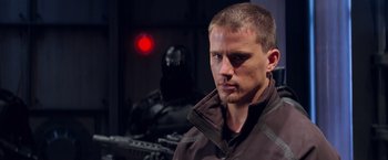 Movie still from “G.I. Joe: The Rise of Cobra” (2009), directed by Stephen Sommers – A person wearing a jacket; Close Up shot, Over the shoulder angle