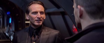 Movie still from “G.I. Joe: The Rise of Cobra” (2009), directed by Stephen Sommers – A person wearing a suit and tie; Close Up shot, Over the shoulder angle