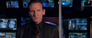 Movie still from “G.I. Joe: The Rise of Cobra” (2009), directed by Stephen Sommers – A person wearing a suit and tie; Close Up shot, Over the shoulder angle