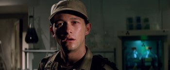 Movie still from “G.I. Joe: The Rise of Cobra” (2009), directed by Stephen Sommers – A man wearing a hat and a camouflage uniform; Close Up shot, Low angle