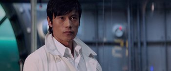 Movie still from “G.I. Joe: The Rise of Cobra” (2009), directed by Stephen Sommers – A man in a white shirt is looking at the camera; Close Up shot, Low angle