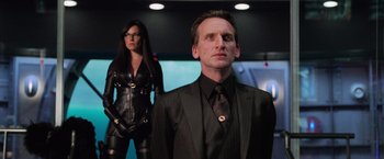 Movie still from “G.I. Joe: The Rise of Cobra” (2009), directed by Stephen Sommers – A man and a woman dressed in black and leather; Medium shot, Low angle