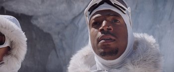 Movie still from “G.I. Joe: The Rise of Cobra” (2009), directed by Stephen Sommers – A person wearing a jacket and hat; Close Up shot, Low angle