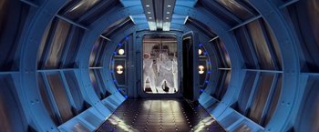 Movie still from “G.I. Joe: The Rise of Cobra” (2009), directed by Stephen Sommers – Two men in white suits are inside of a spaceship; Wide shot, Overhead angle
