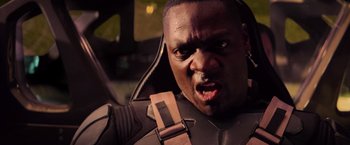 Movie still from “G.I. Joe: The Rise of Cobra” (2009), directed by Stephen Sommers – A person wearing a suit and tie; Close Up shot, High angle