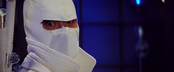 Movie still from “G.I. Joe: The Rise of Cobra” (2009), directed by Stephen Sommers – A man in a white ninja suit with a white mask; Close Up shot, Low angle