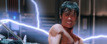 Movie still from “G.I. Joe: The Rise of Cobra” (2009), directed by Stephen Sommers – A shirtless man with a lightning behind him; Close Up shot, Low angle