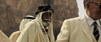 Movie still from “All the Money in the World” (2017), directed by Ridley Scott – An old man with a beard wearing a turban; Close Up shot, Over the shoulder angle