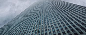 Movie still from “All the Money in the World” (2017), directed by Ridley Scott – A skyscraper that has been designed to look like san francisco; Extreme Wide shot, Low angle