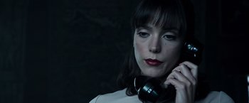 Movie still from “All the Money in the World” (2017), directed by Ridley Scott – A woman with red lipstick is talking on the phone; Close Up shot, Low angle
